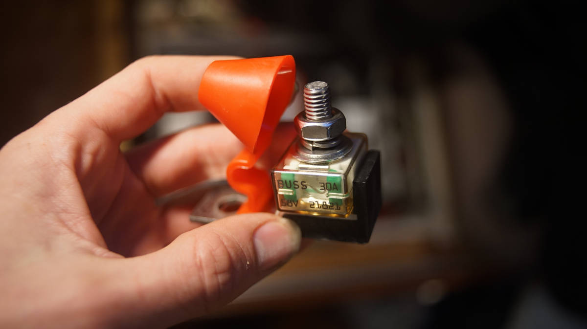 a hand holding a mrbf terminal fuse block