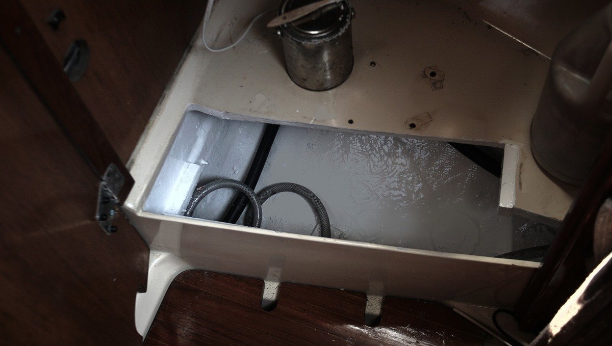 Photo of a hole in the floor of a sailboat