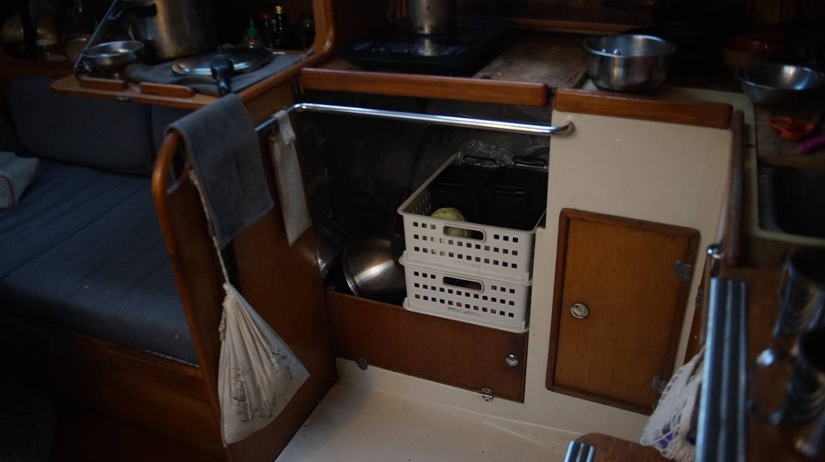 the old oven is gone, two baskets of produce are laying in the gap where it used to be