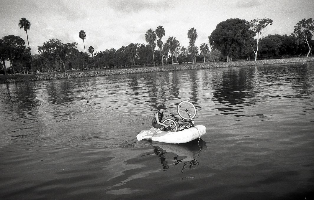 rek is rowing iggy the inflatable with a bike along for the ride, the bike barely fits inside the dinghy