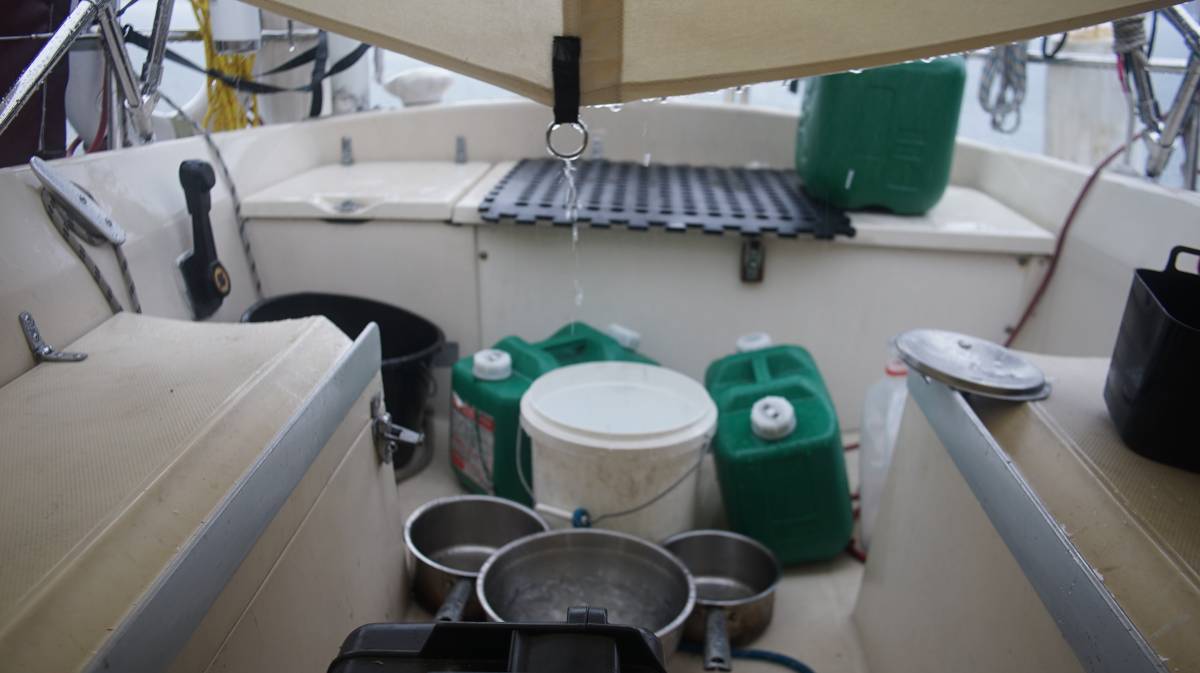 bowls set under an inverted cockpit tent to catch rain water