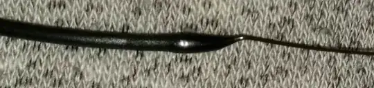 Photo of filament with a blob of filament a the end after being pulled from the hotend Photo of filament with a blob of filament a the end after being pulled from the hotend