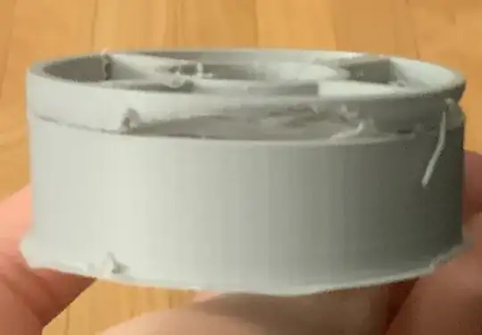 Photo of a printed model where the top portion has begun to show stringing Photo of a printed model where the top portion has begun to show stringing