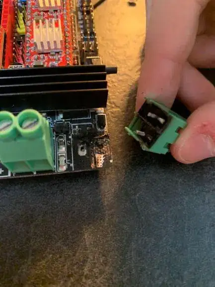Top side of PCB and underside of power screw terminals, showing burning Top side of PCB and underside of power screw terminals, showing burning