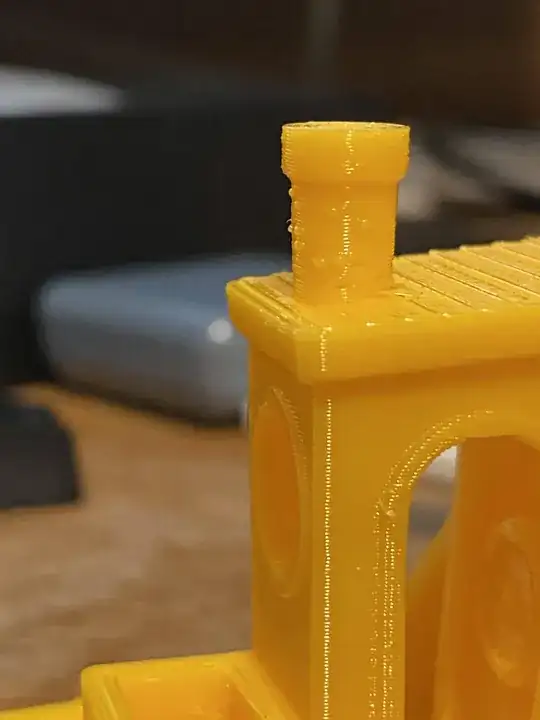 Photo of a printed Benchy with zits on the chimney Photo of a printed benchy with zits on the chimney
