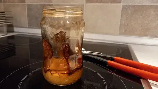 Glass jar with burnt melted plastic