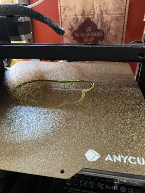 Photo of the first few layers of a printed model but front edge is very thin on the build plate Photo of the first few layers of a printed model but front edge is very thin on the build plate