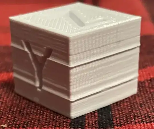 Photo of a calibration cube with strange thick looking layers around the whole print