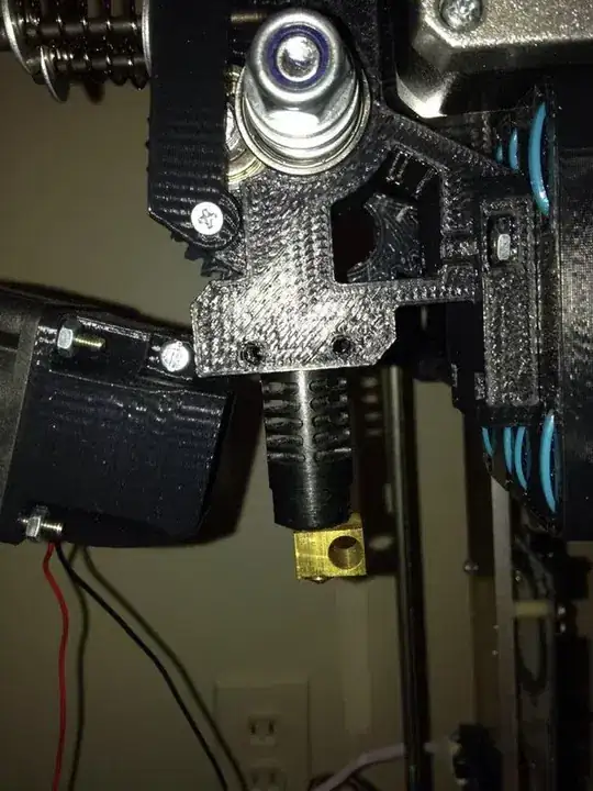 Image of two holes in the side of the x-carriage with a J-Head Extruder just below it (pushed up a little bit)