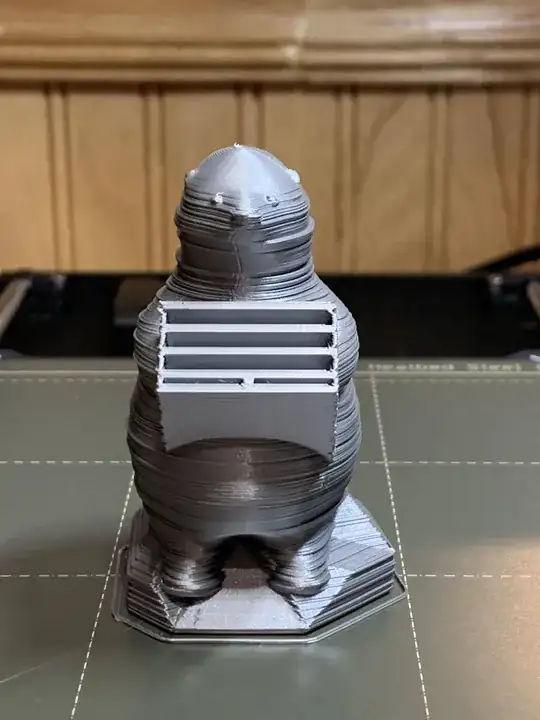 Test print of an SD card bear holder, layer lines seem to be sticking out Test print of an SD card bear holder, layer lines seem to be sticking out