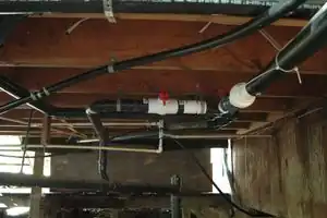 Fig 1: Greywater and sewer valves underneath the house.