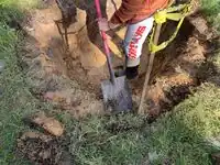 Image 1: Berm area was leveled and cleared of debris and excess clay to prepare for berm construction.
