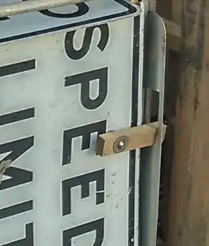 Fig 8: The front door of the second stage box is attached to the frame with hinges, and secured on its free end with a simple wooden latch that slides into the adjacent side piece.