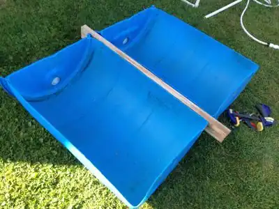 Sectioned 55-gallon drum attached to the yoke.