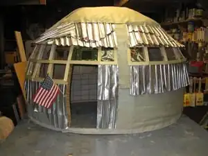 Aluminum AwarenessAluminum can shingles and 2-liter bottle windows