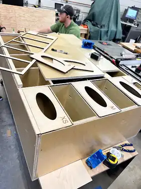 Instaltion of slides and channels used to create the front face of the glove box compartments.