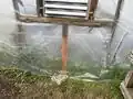 Reinforcing the bottom of the greenhouse to be able to hold the fan and exhaust shutters.