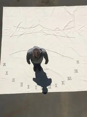 SundialAn sundial in the concrete entrance that relies on students to tell time.