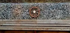 pirate's cove cornerA pirate themed agricultural area replete with gabions, rope, and a ship wheel.