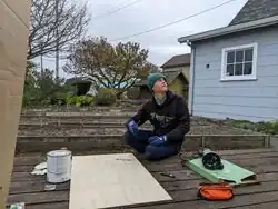 Sasha looks up from outlining the Peg Maze