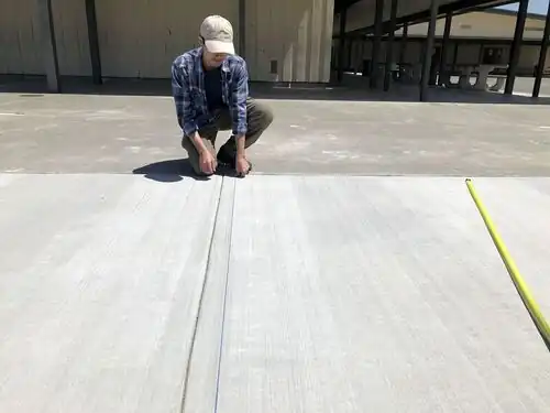Minh Truong- Holding the opposite end of a chalk line being used to mark out where the duct tape and paint needs to go.