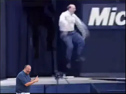 Chuck with Steve Balmer jumping around.