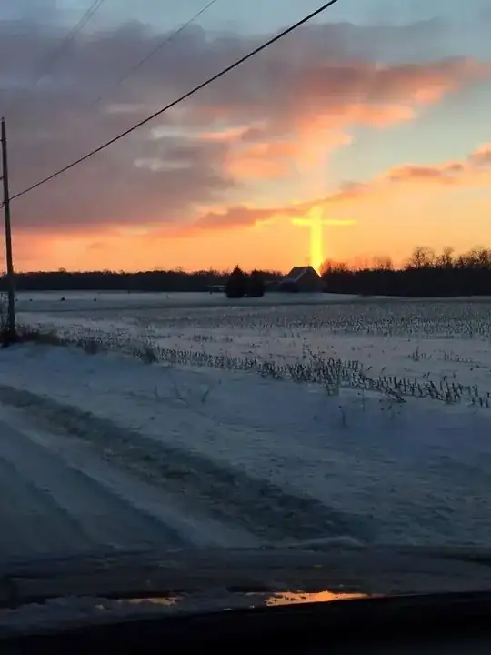 Sun pillar plus clouds
