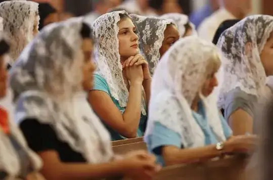ladies wearing white veils