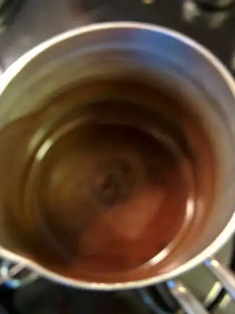 Nearly boiling Turkish coffee in cezve