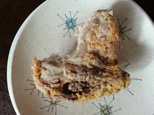 Chicken thigh with gizzard thing exposed