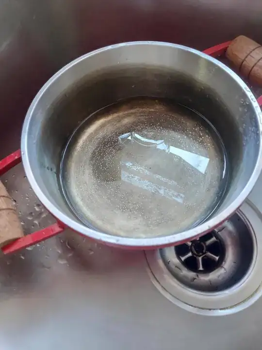 The pot in question, with its bottom blackened roughly to the waterline