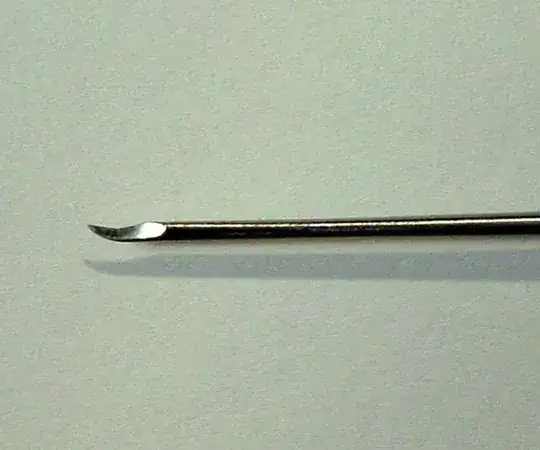 Photo of the beaver blade, a small, hooked metal tip