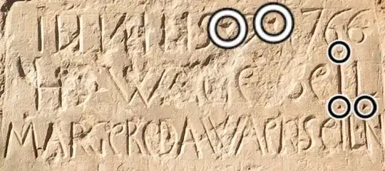 showing intentially placed dots over 'I' (2), the 1st leg of suffix 'N' & before & after '9' in date