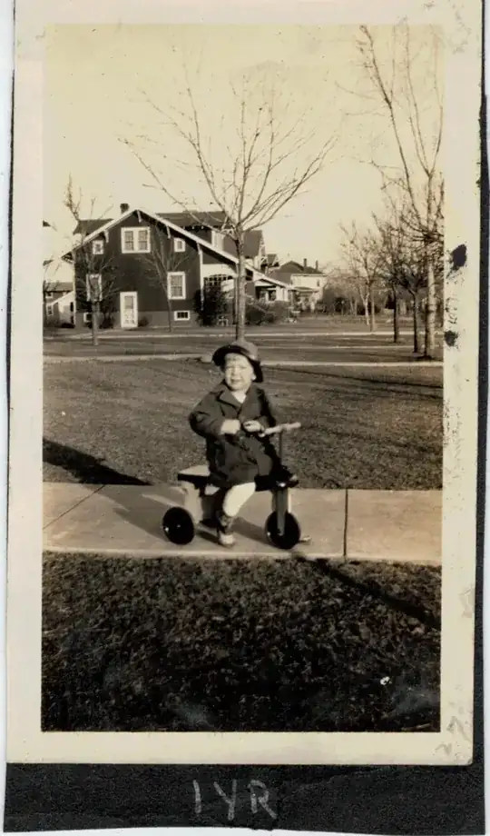 1 Year old child on toy tricycle