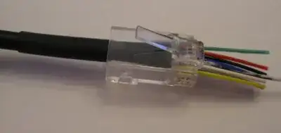 Heat shrink shrunk around cable, with EZ-RJ45 in position, not yet crimped