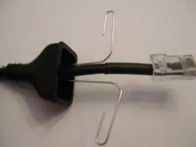 Paperclips unfolded and placed between wire and boot