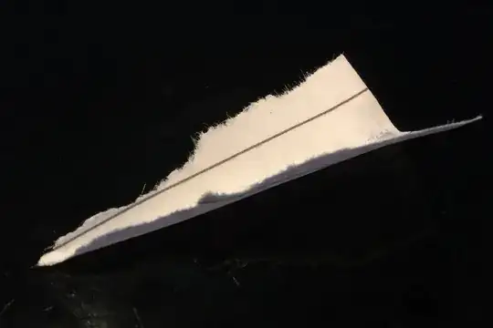 a piece of paper torn into a triangle and bent for rigidity