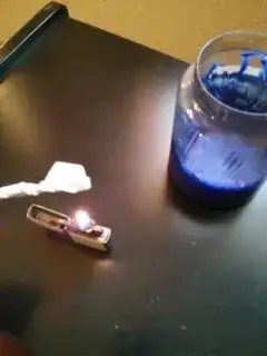 a lit strip of twisted paper