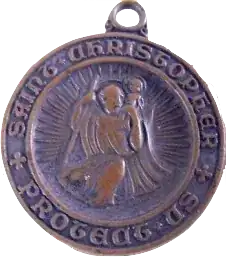 bronze St. Christopher medallion with the name "Saint Christophe" inscribed on the edge