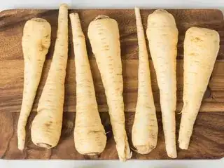 white, long, vaguely cone-shaped parsnips