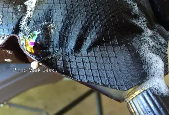 Photo of soapy pad with pin in leak