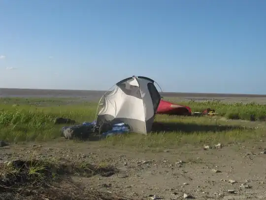 Tent tethered to packs to keep it from blowing away.