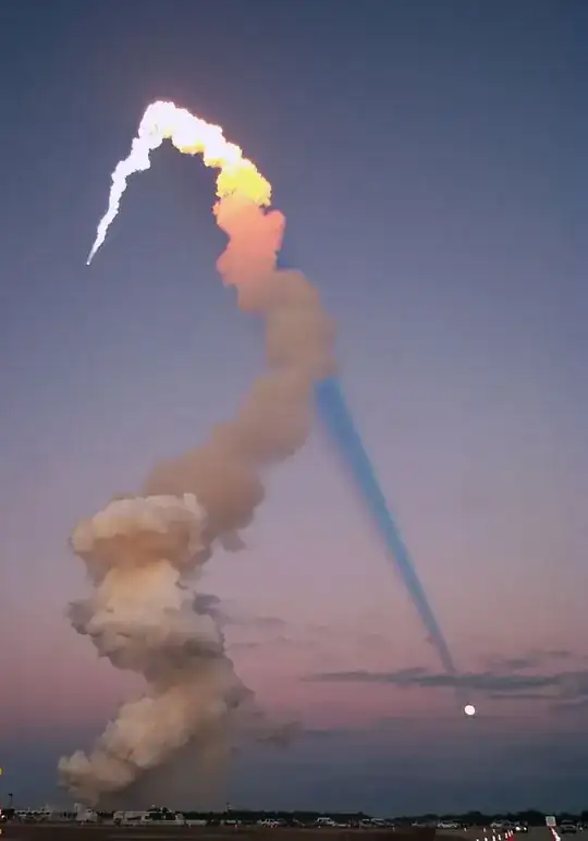 Shuttle plume shadow points to the Moon