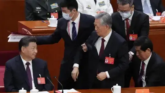 The removal of former Chinese president Hu Jintao (centre) has sparked a flurry of questions. (AP PHOTO) Credit: AP