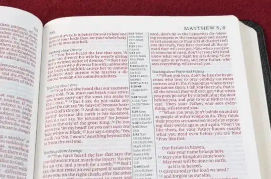 Two-column book with annotation between columns.