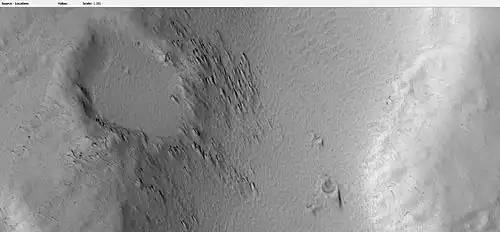 Crater on edge of lava flow on Hecates Tholus, as seen by HiRISE under HiWish program.  Lava seems to have formed tail shape on the lee side of obstacles like crater rims.