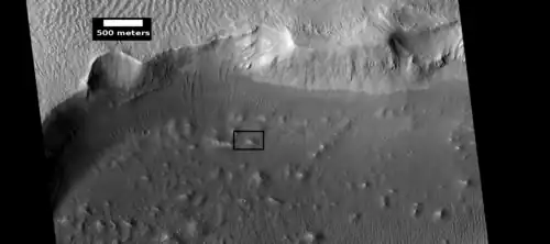 Crater wall and floor in Lycus Sulci, as seen by HiRISE under HiWish program.  The crater floor contains many mounds and ridges.  The part in the box is enlarged in the next photo.