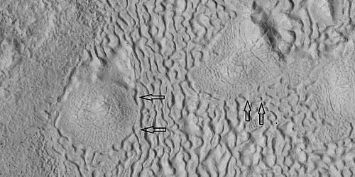 Brain terrain being formed, as seen by HiRISE under HiWish program. Note: this is an enlargement of the previous image using HiView.  Arrows indicate spots where brain terrain is beginning to form.