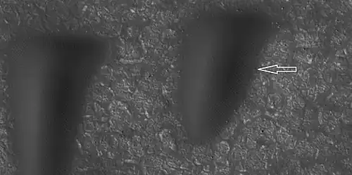 Boulder and boulder tracks, as seen by HiRISE under HiWish program. The arrow shows a boulder that has made a track in the sand as it rolled down dune.  Location is Mare Boreum quadrangle.