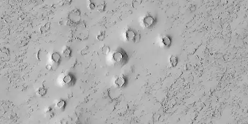 Close view of cones, as seen by HiRISE under HiWish program. These cones probably formed when hot lava flowed over ice-rich ground.  The location is the Elysium quadrangle.